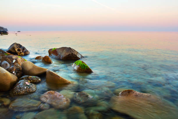 istock quiet emerald sea bay before a sunrise 941297948