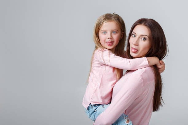 istock mother and daughter having fun together 941300254