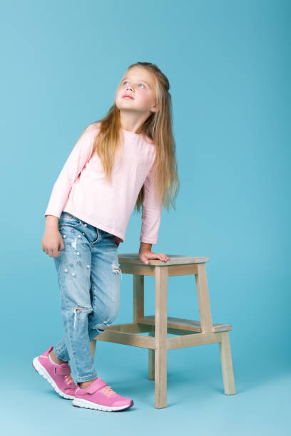 istock little girl in pink sweater 941303894