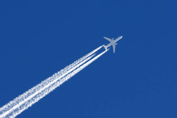 istock White big passenger airplane three engines aviation airport contrail clouds. 941304022