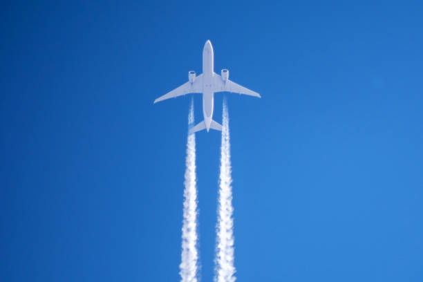 istock White big passenger airplane two engines aviation airport contrail clouds. 941304068