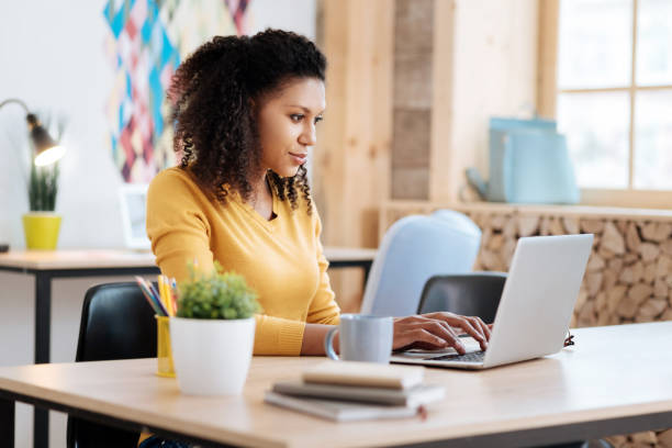 istock Inspired woman working on her laptop 941306298