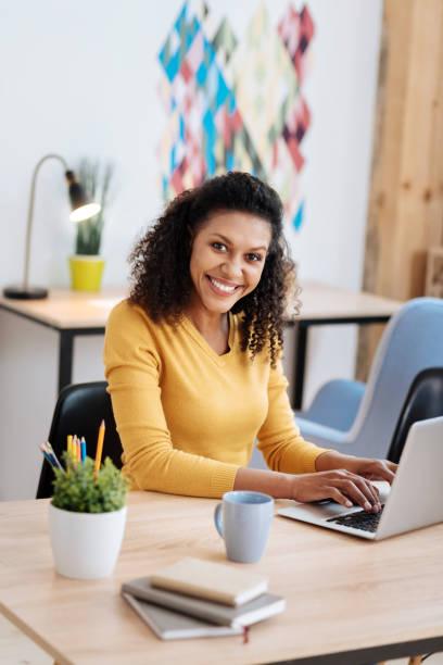 istock Smiling woman working in the office 941306344