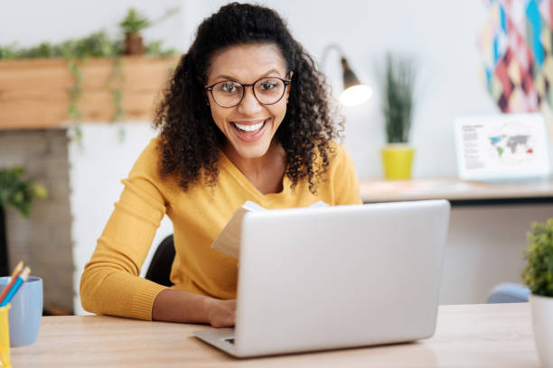 istock Cheerful businesswoman working on her laptop 941306568