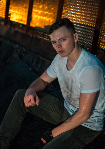 istock Lonely Young Man on Rooftop at Night 941307170