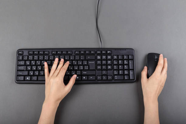 istock two female hands on the keyboard, work in the office, office equipment 941309826