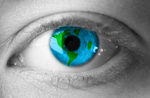world in eye. save the planet concept