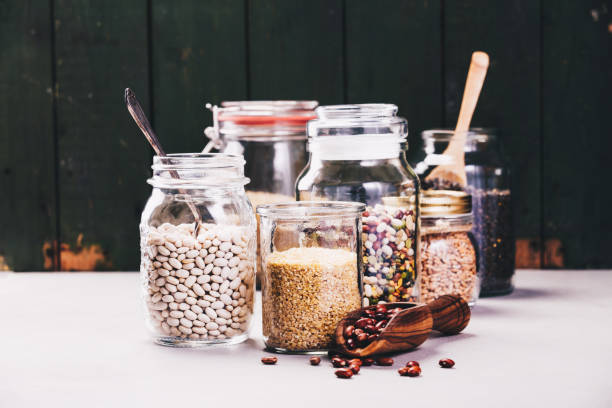 istock Glass jars with various legumes and grains 941316876