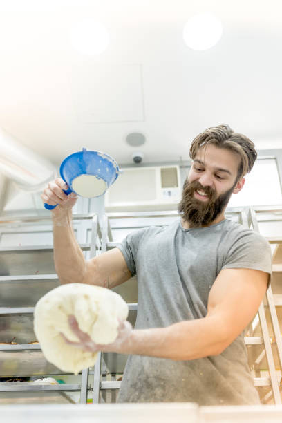 Man playing with flour