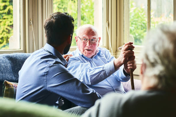 istock Senior man talking with health visitor 941321232