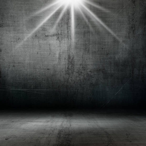 istock 3D grunge style interior with spotlight shining down 941324192