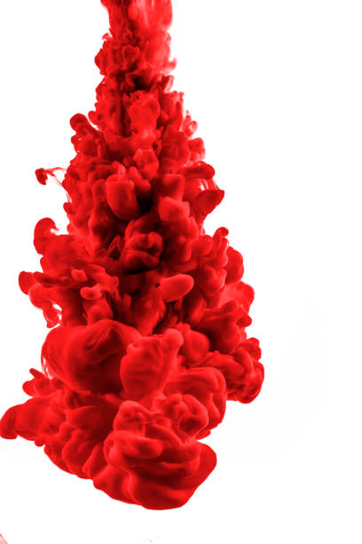 istock red dye in water on white background 941325300