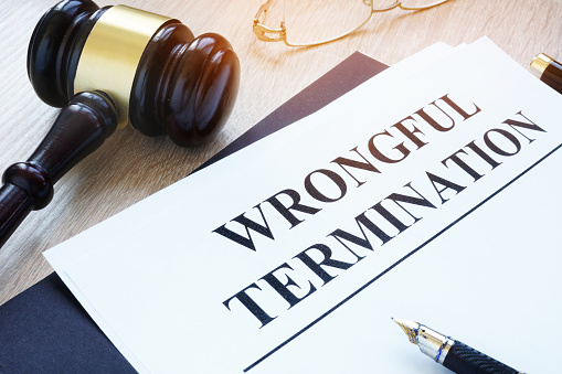 Documents about wrongful termination and gavel.
