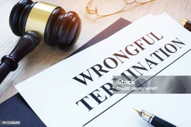 Documents About Wrongful Termination And Gavel Stock Photo - Download Image Now - Finishing, Employment And Labor, Employee