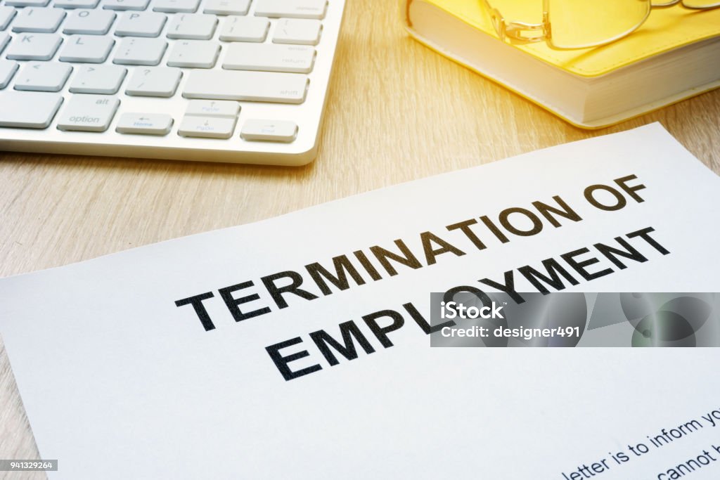 Termination of Employment on an office desk. Being Fired Stock Photo