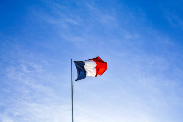 istock French flag waving the wind in Paris. 941330004