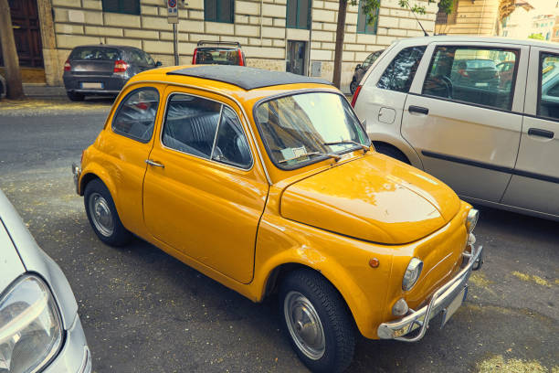 istock Yellow retro car on Rome street 941333422