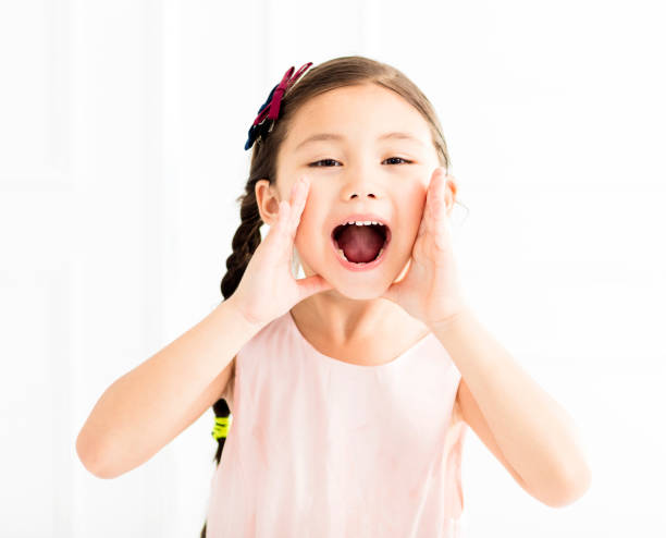 istock happy Little girl shouting 941338932