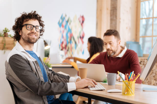 istock Happy young employee working in the office 941339050