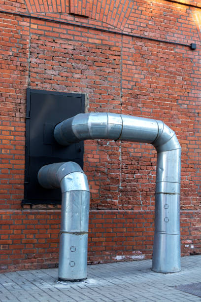 istock Two large pipes entering the house 941339612