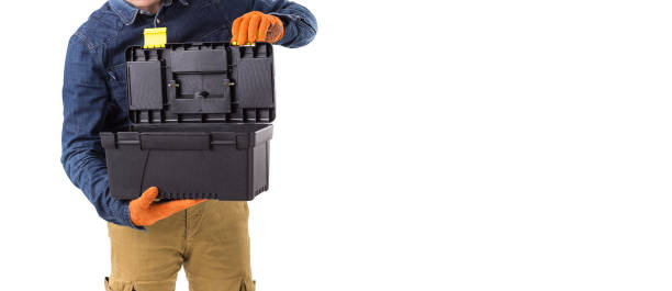 istock repairman (builder) holds the tool box in his hand isolated on white background with copy space 941341562