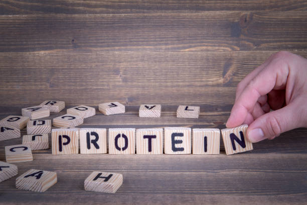 istock Protein. Wooden letters on the office desk 941346718