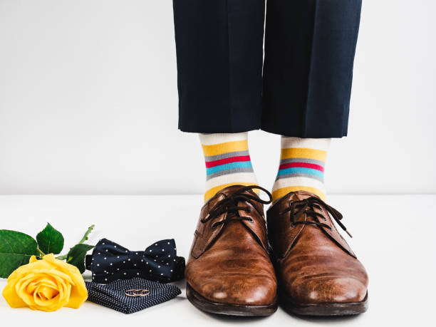 istock Wedding rings, rose and funny socks 941347392
