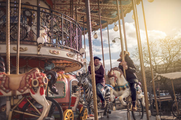 istock Best friends having fun on Carousel 941350830