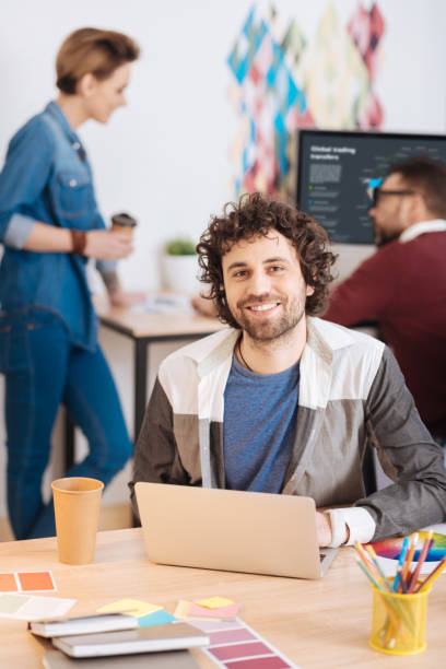 istock Inspired young man working on his laptop 941351542