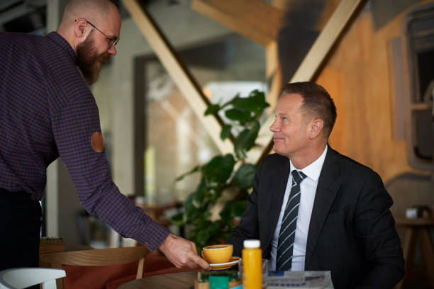 istock Waiter in coffee shop 941352142