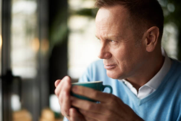 istock Businessman in coffee shop 941352726