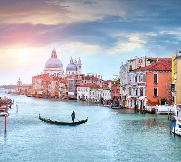 istock Canal Grande and Traditional gondola with a dramatic sky, Venice 941360018