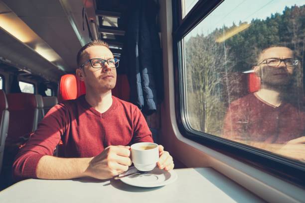 Young man traveling by train