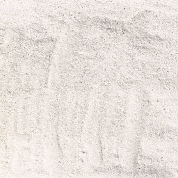 istock Texture of white sand beach for background 941365078
