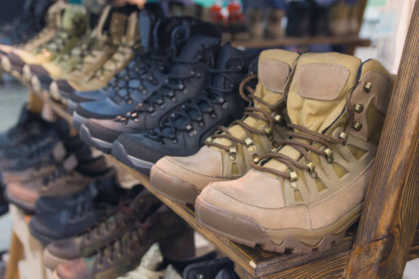 Army boots are in line at the store counter. Shoes stock photo