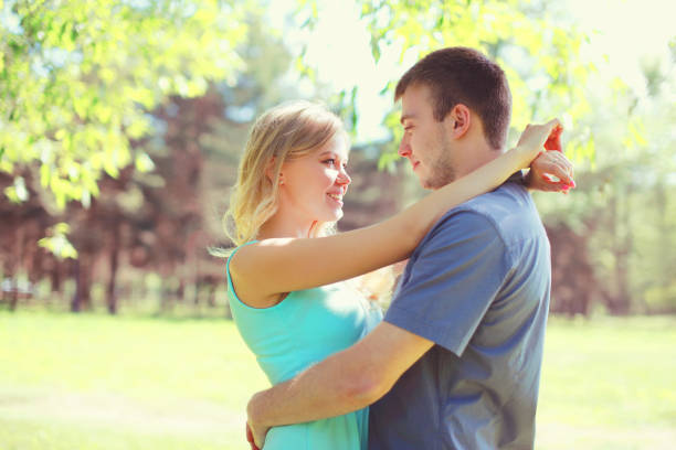 istock Happy young couple hugs at sunny spring day 941365862