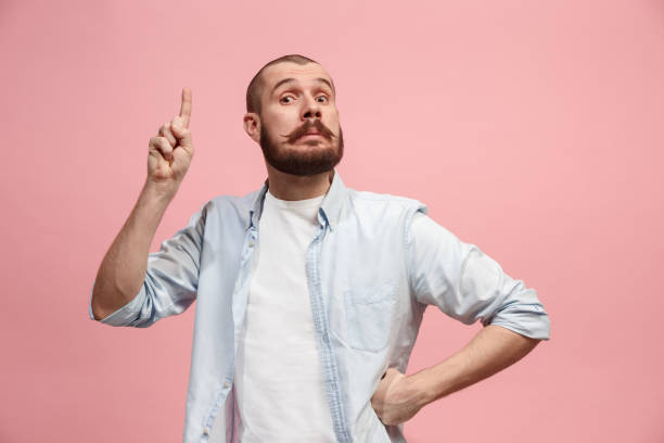 istock Young serious thoughtful businessman. Doubt concept 941369728