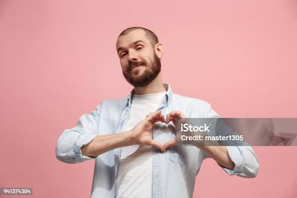 Portrait Of Attractive Man With Kiss Isolated Over Pink Background Stock Photo - Download Image Now