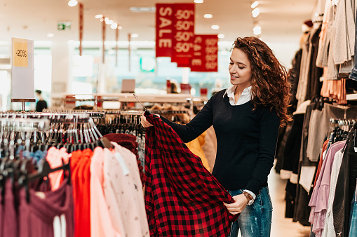 Businessman trying suit in store