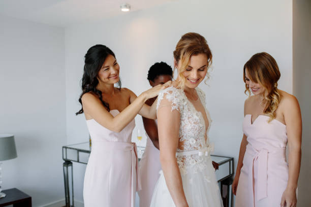istock Bridesmaids preparing bride for the wedding day 941381666