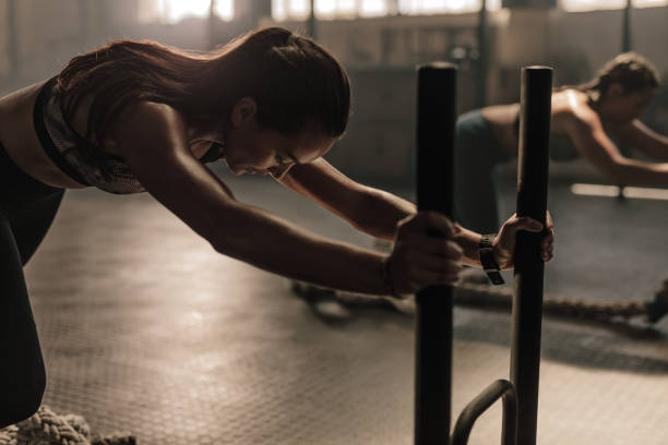 istock Women doing intense physical workout in gym 941381908