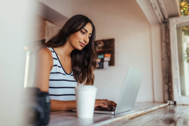 istock Woman working on laptop computer at home 941388286