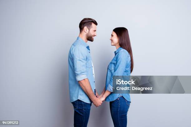 Concept Of Love Two Young Happy People With Beaming Smile Standing Facetoface And Holding Hands Stock Photo - Download Image Now