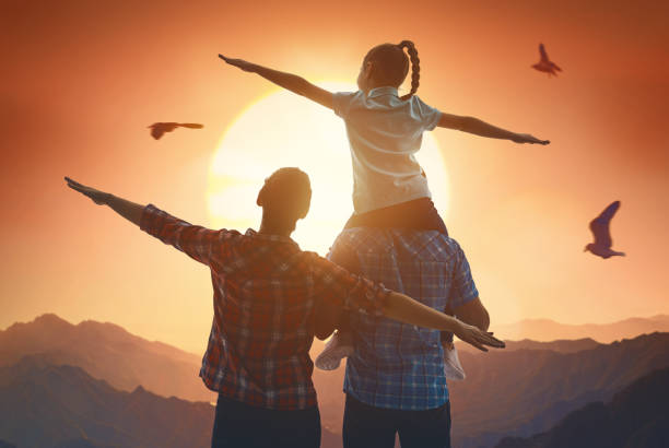istock family at sunset 941391890