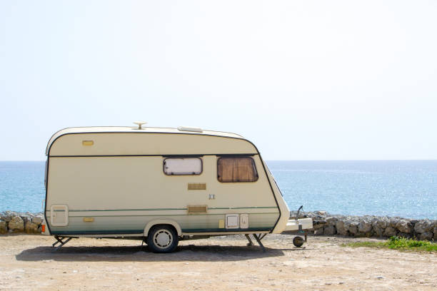 istock Retro caravan near the ocean 941392158