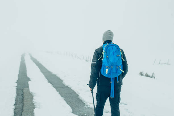 istock Man climbing a mountain for sport 941392442