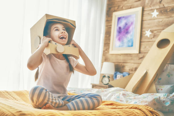 istock girl in an astronaut costume 941406772