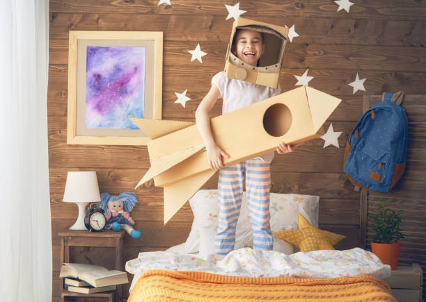 istock girl in an astronaut costume 941406800