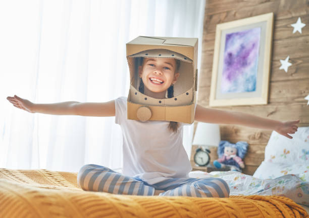 istock girl in an astronaut costume 941406906