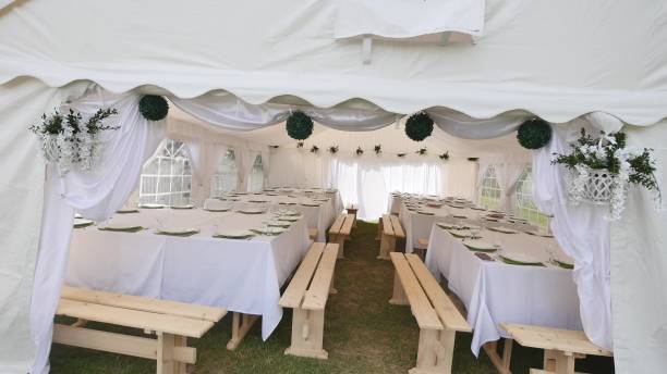 istock Beautiful Banquet hall under a tent for a wedding reception 941407058